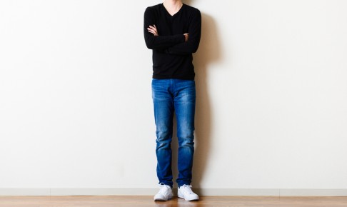 Man,Standing,In,Front,Of,The,Wall,Of,The,Room